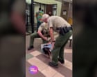 Woman shoved to the ground and arrested during Utah county datacenter hearing – video