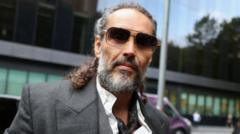 Russell Brand accuser says alleged rape left her afraid she may be pregnant