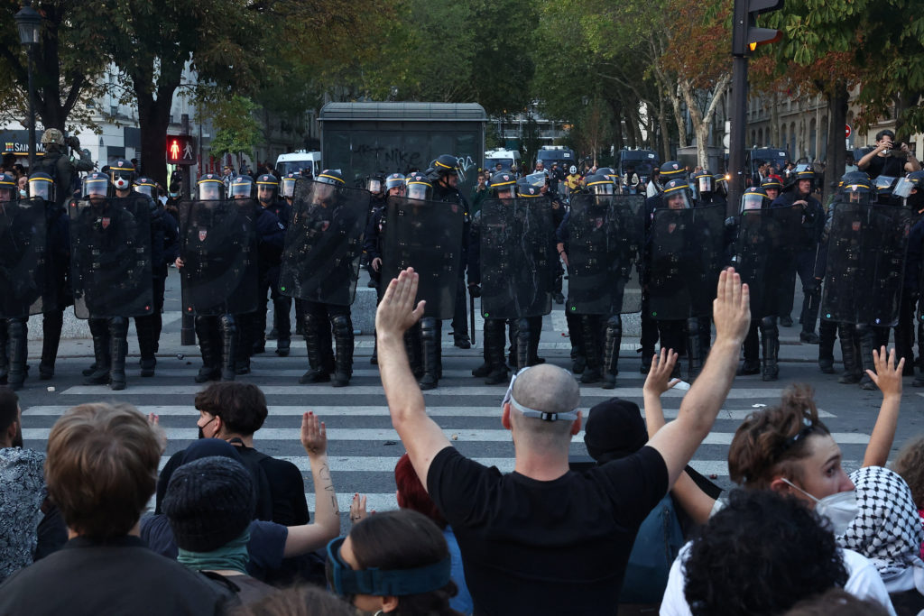 French police fire tear gas as more than 250,000 protest nationwide for school funding