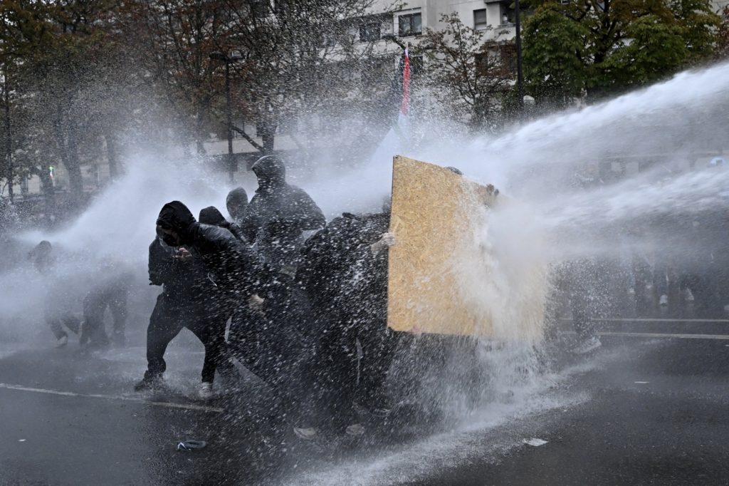 More than 400,000 protest across France, challenging Macron as Paris clashes erupt
