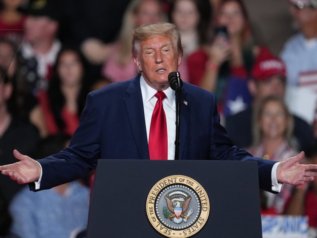 The Latest: Trump interrupted by protesters as he campaigns for Paxton in US Senate race in Texas