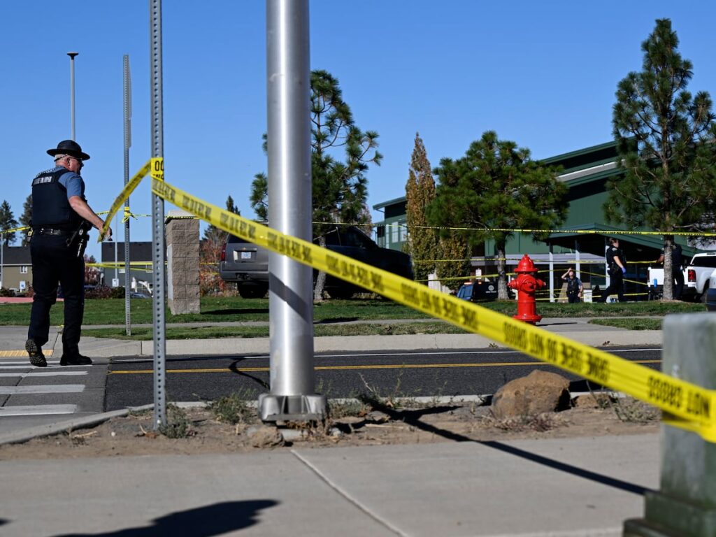 The Latest: Teacher threw cellphone and tackled gunman who killed 4 at Oregon school, police say