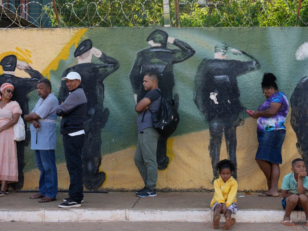 Brazil votes in a tense Lula vs Bolsonaro runoff as extended voting hours cause confusion