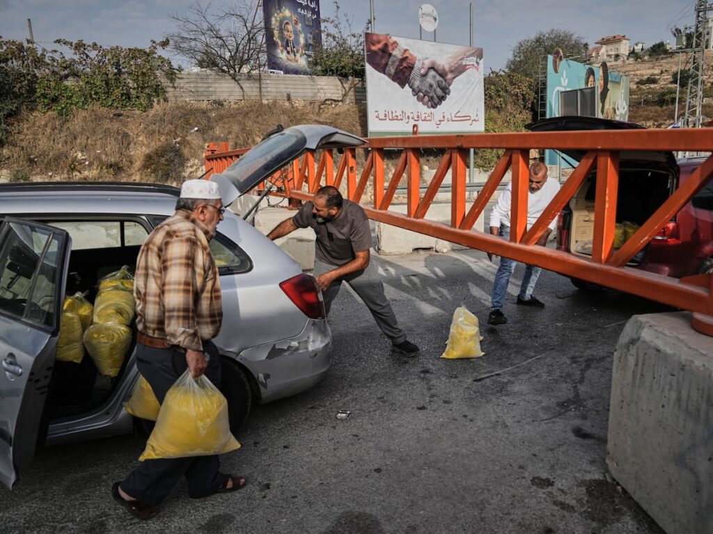 Israel imposes closures across a West Bank city after attacks, and other Mideast news