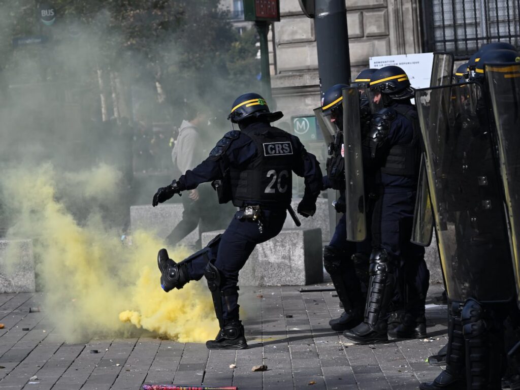 Scuffles break out as protesters rally across France, joining students