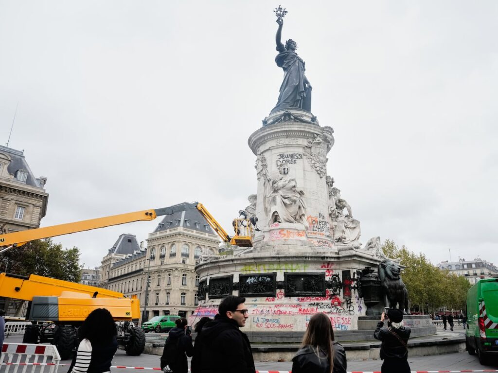 Thousands gather in Paris after a court lifts a protest ban despite fears of new violence