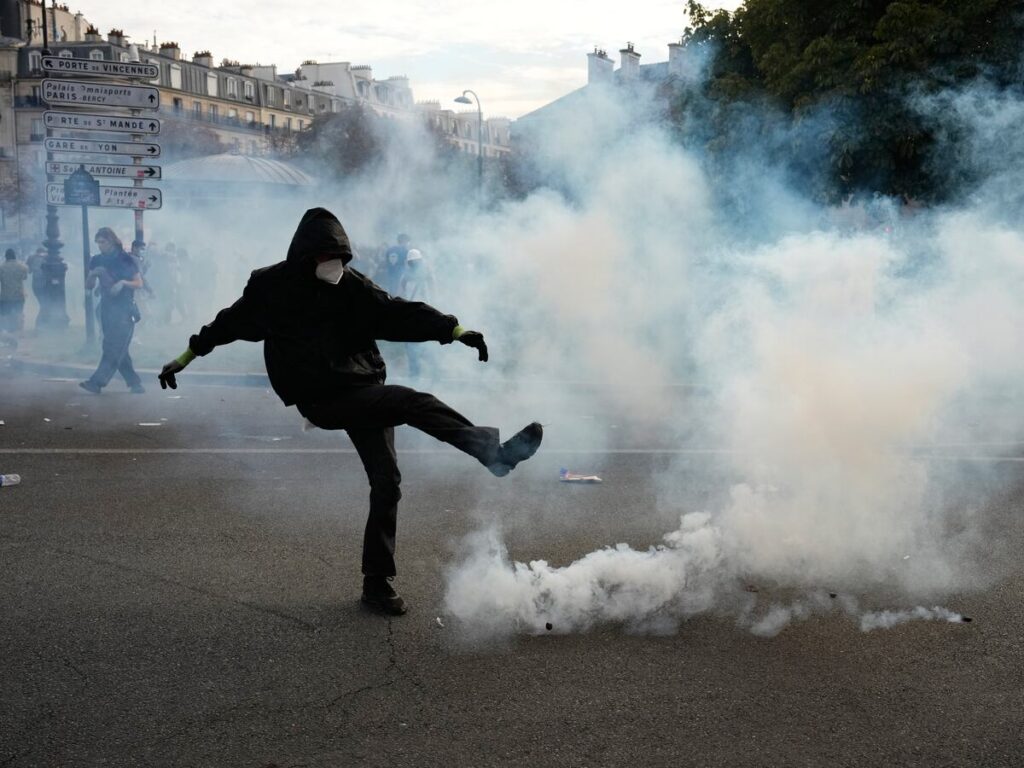 French riot police fire tear gas as more than 250,000 rally nationwide for school funding