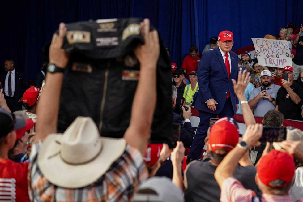 Protesters dragged out of Trump rally as president erupts over repeated disruptions