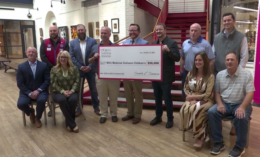 Party on the Plaza presents donation check to WVU Medicine Golisano Children's