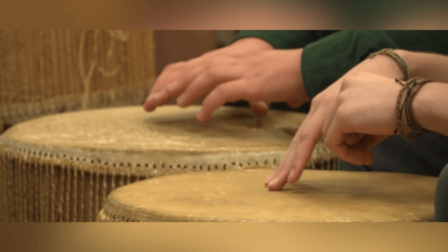 Son of WVU professor donates African drums to John Marshall High School