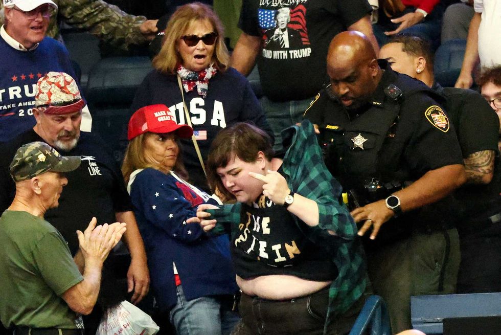 Woman Trump mocked as 'a fat guy' lawyers up as men who punched her go uncharged: report
