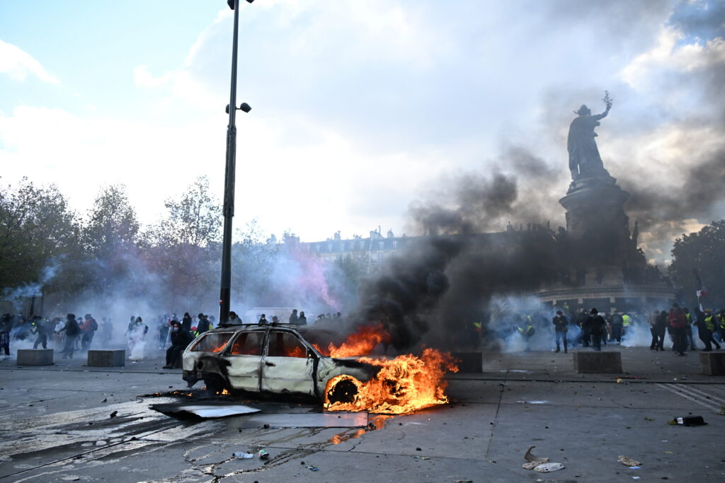 Scuffles and fires break out as protesters rally across France, joining students