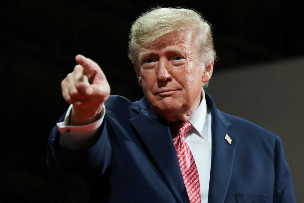 Trump repeatedly interrupted by protesters amid election screed in Kansas